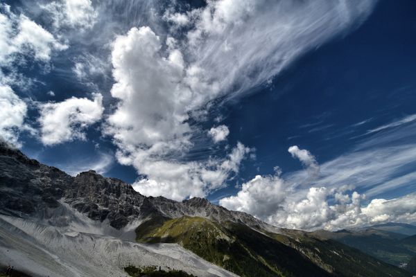 View from top of a mountain onto a sea and another mountain in
austria.